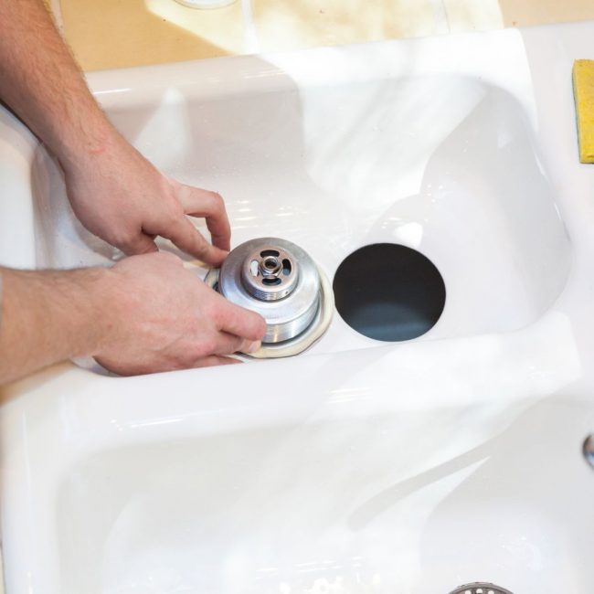 clogged double sink with garbage disposal